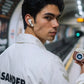 Commuter using CTRL8 Retro Camera Design Portable TWS Wireless Earbuds with stylish case and battery display at a subway station